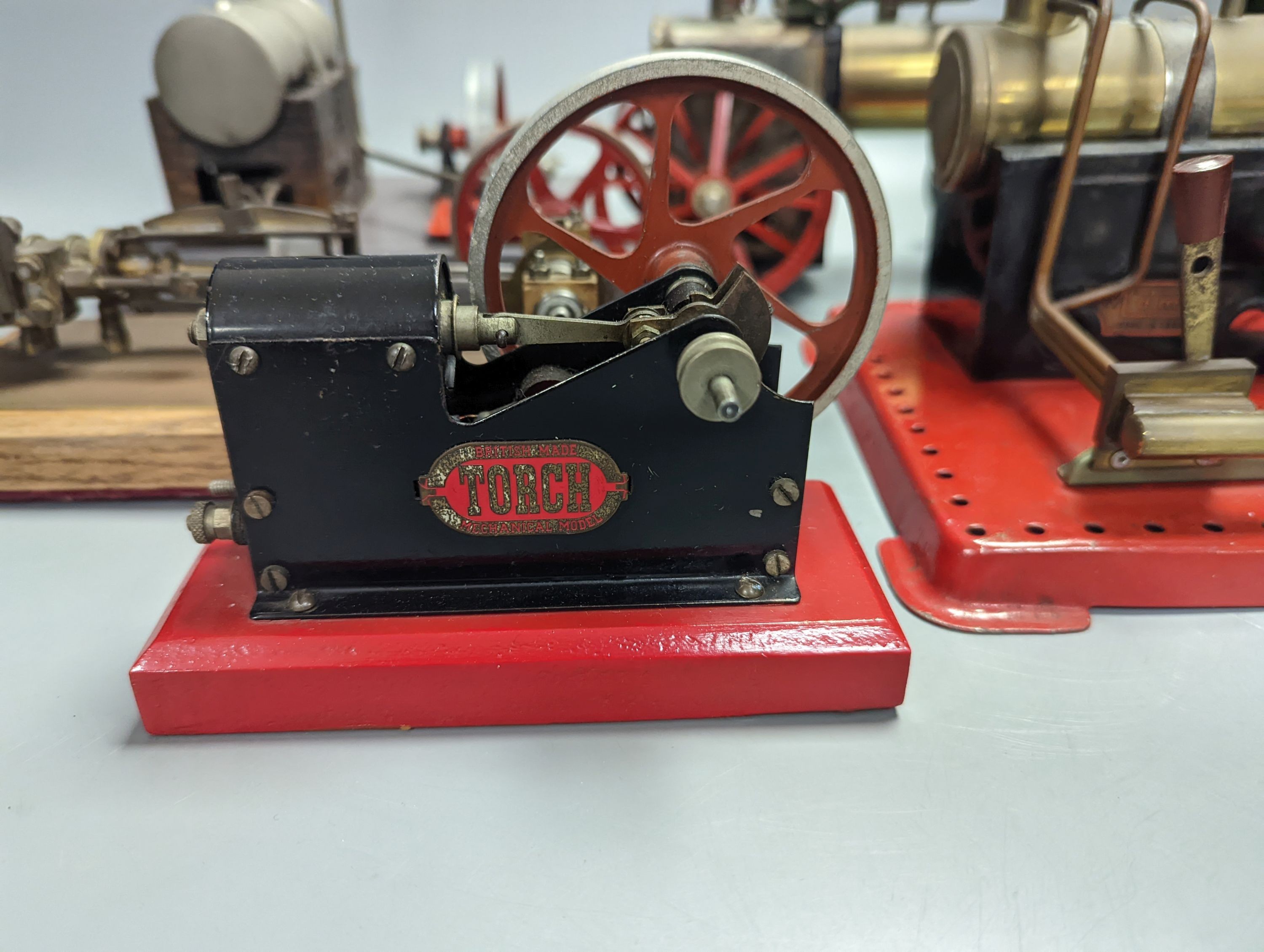 Four horizontal stationary steam engines, including Mamod and Torch and a Mamod steam wagon, 23cm